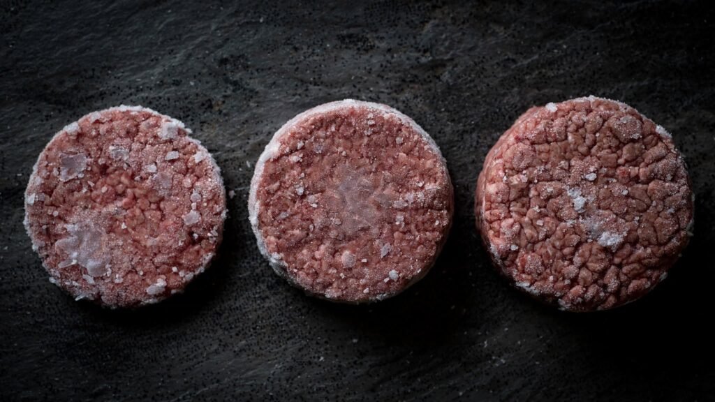 Frozen hamburger patties with different thicknesses and sizes